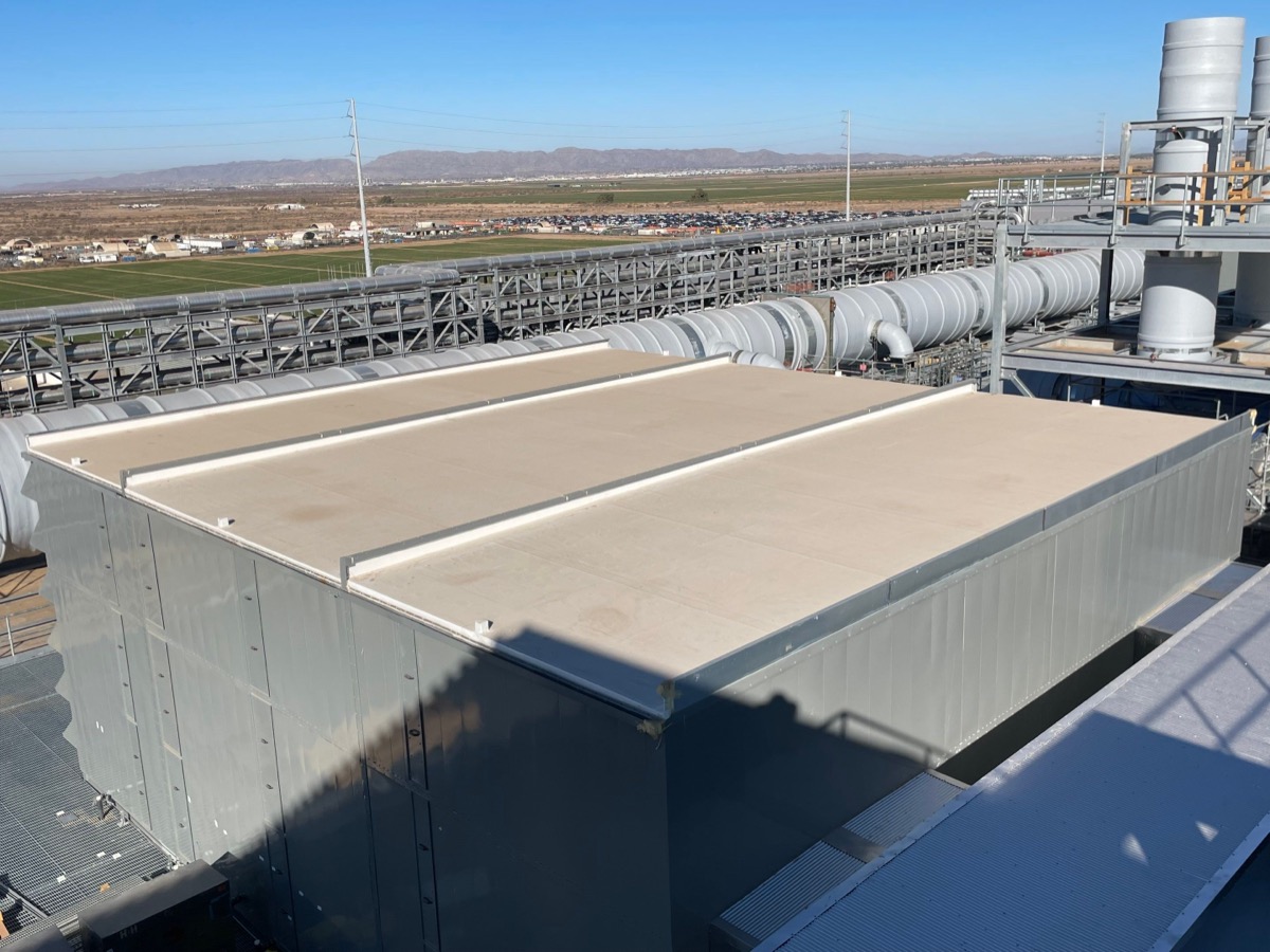 Completed roofing sections on industrial facility equipment enclosures