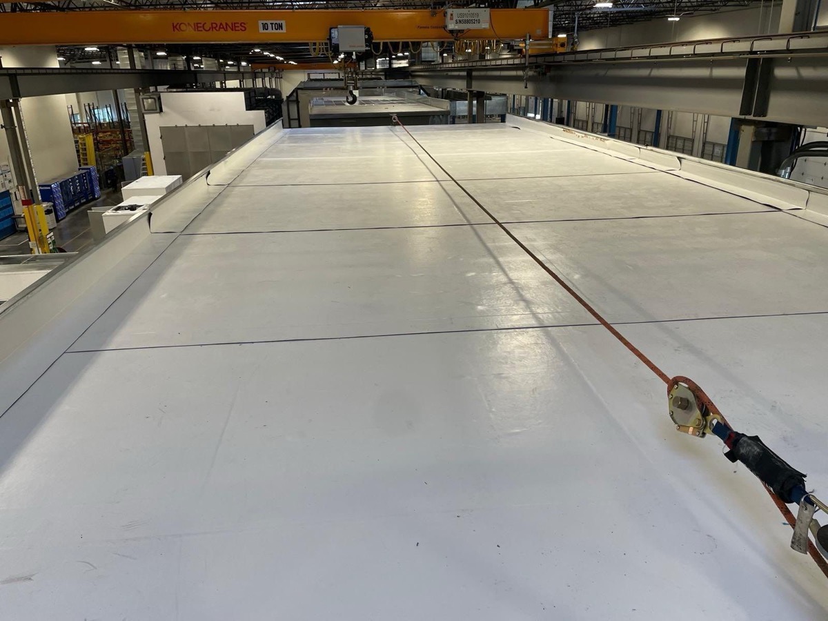Wide expanse of newly installed white single-ply membrane